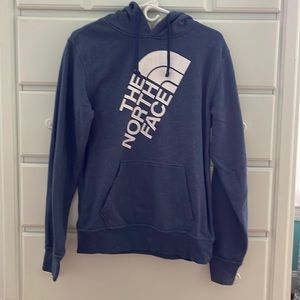 Blue North Face hoodie.